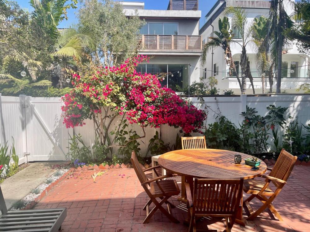 King Oasis - steps to beach with garden patio!